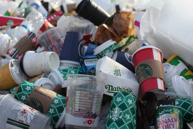 Why is hot coffee in plastic cups a potential problem